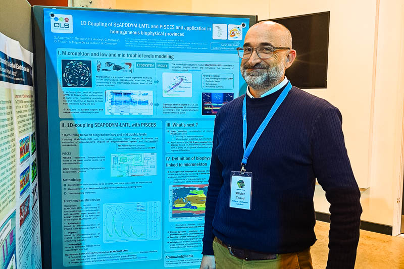 Olivier Titaud in front of his research poster